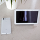 The Google Pixel 3 (left) is about two-thirds the size of the display on the Home Hub (right).